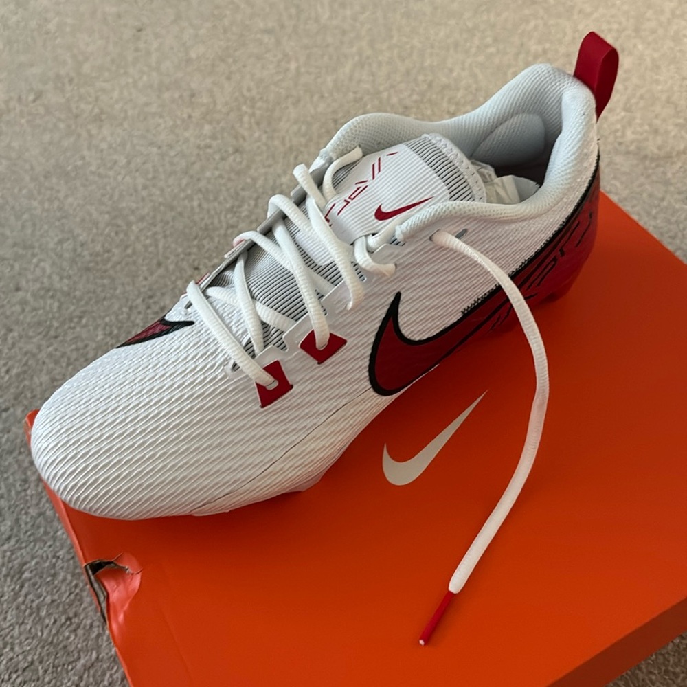 Brand new Nike football cleats size 10 1/2 men’s white and red never worn